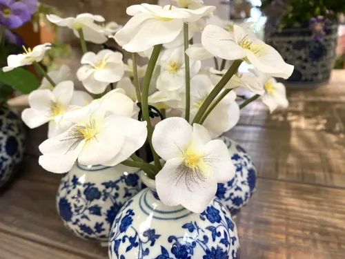 faux white pansy in vase