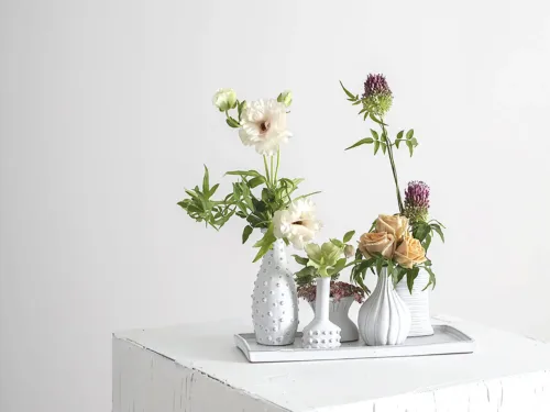 set of five bud vases white ceramic